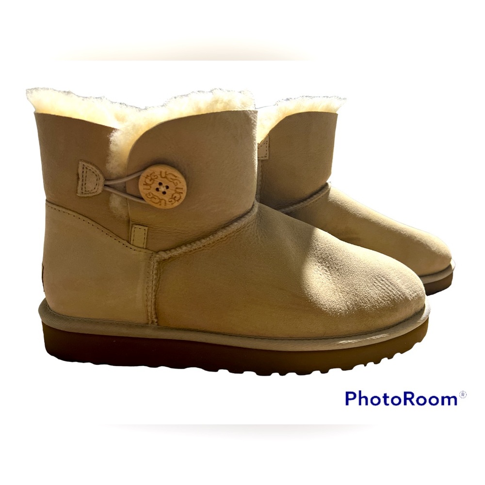 Ugg sheepskin tan/ cream boots. New out of box. Women’s sz 10.